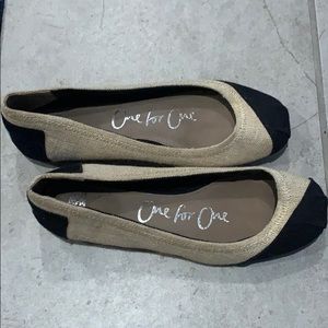 Tan and black Toms, size 6.5.